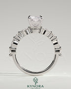 Kynora CJ 2ct radiant claw solitaire engagement ring with marquise and round accent stones, elegant and sparkling jewelry piece.