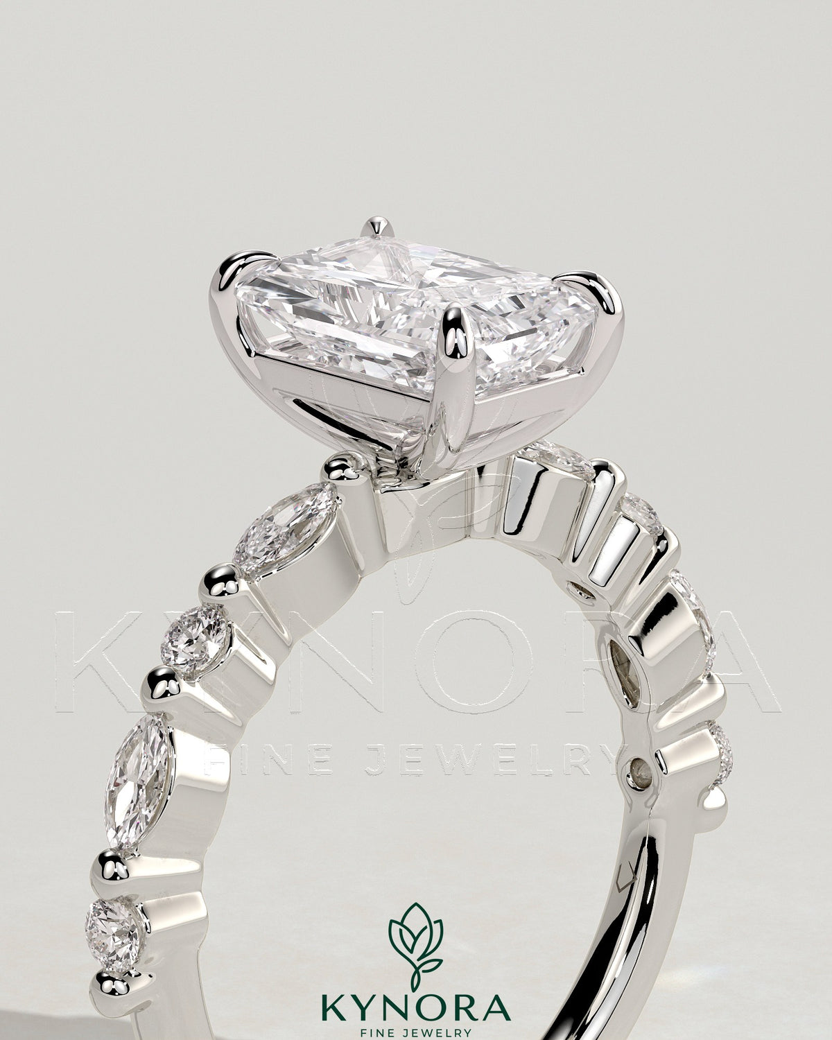 Kynora CJ 2ct radiant diamond claw solitaire engagement ring with marquise and round accent stones, elegant jewelry design
