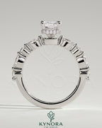 Kynora CJ 2ct radiant claw solitaire engagement ring with marquise and round accent stones, and a wrap-around hidden halo design.