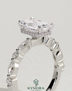 Kynora CJ 2ct radiant claw solitaire engagement ring with marquise and round accent stones, featuring a wrap-around hidden halo design.