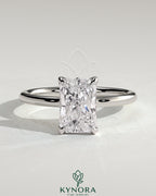 Kynora CJ 2ct radiant diamond solitaire engagement ring with petal gallery, leaf accents, and cathedral setting.