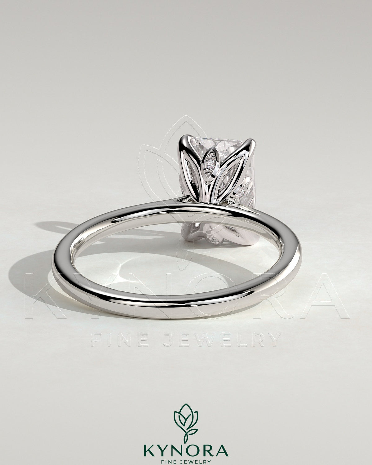 Kynora CJ 2ct radiant diamond solitaire engagement ring with petal gallery, leaf accents, and cathedral setting.