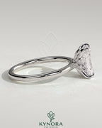 Kynora CJ 2ct radiant claw solitaire engagement ring with petal gallery, leaf accents, and cathedral setting.