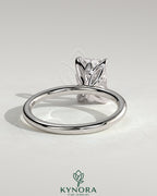 Kynora CJ 2ct radiant claw solitaire engagement ring with petal gallery and accent leaf details, crafted in elegant gold.