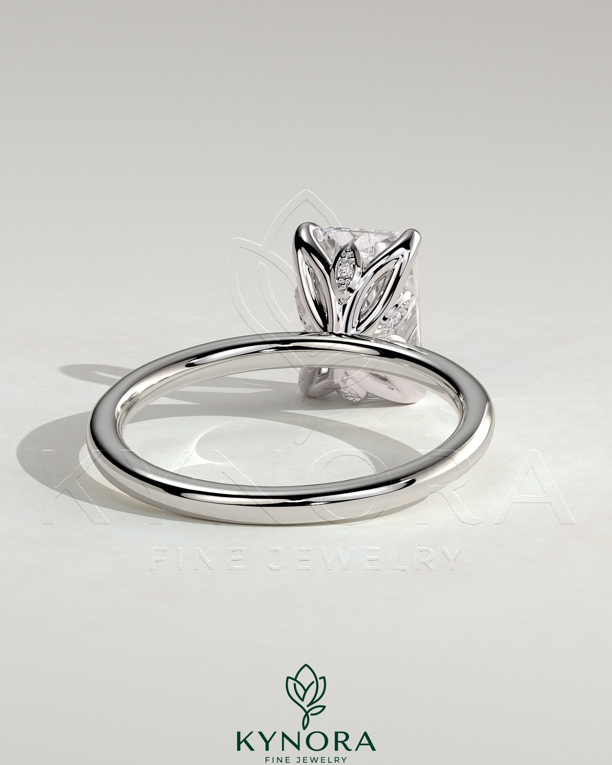 Kynora CJ 2ct radiant claw solitaire engagement ring with petal gallery and accent leaf details, crafted in elegant gold.