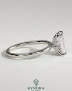 Kynora CJ 2ct radiant claw solitaire engagement ring with petal gallery and leaf accents, elegant and intricate design.