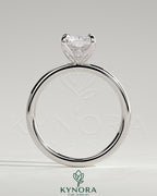 Kynora CJ 2ct radiant claw solitaire engagement ring with petal gallery and accent leaf details, showcasing fine craftsmanship.