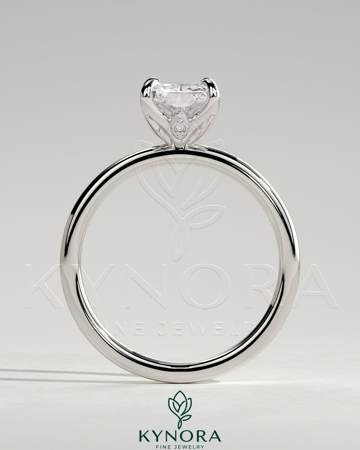 Kynora CJ 2ct radiant claw solitaire engagement ring with petal gallery and accent leaf details, showcasing fine craftsmanship.
