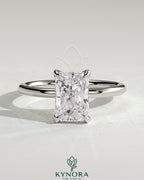 Kynora CJ 2ct radiant claw solitaire engagement ring with petal gallery and accented tiara detail, showcasing intricate design and diamond setting.