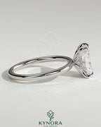 Kynora CJ 2ct radiant claw solitaire engagement ring with petal gallery and accented tiara detail, showcasing intricate design.