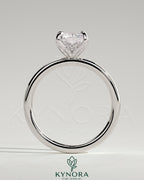 Kynora CJ 2ct radiant claw solitaire engagement ring with petal gallery and accented tiara detail in sterling silver.