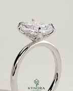 Kynora CJ 2ct radiant claw solitaire engagement ring with petal gallery and accented tiara detail, featuring a sparkling central diamond.