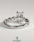 Kynora CJ 2ct radiant claw solitaire engagement ring with round accent stones and hidden halo design in sterling silver