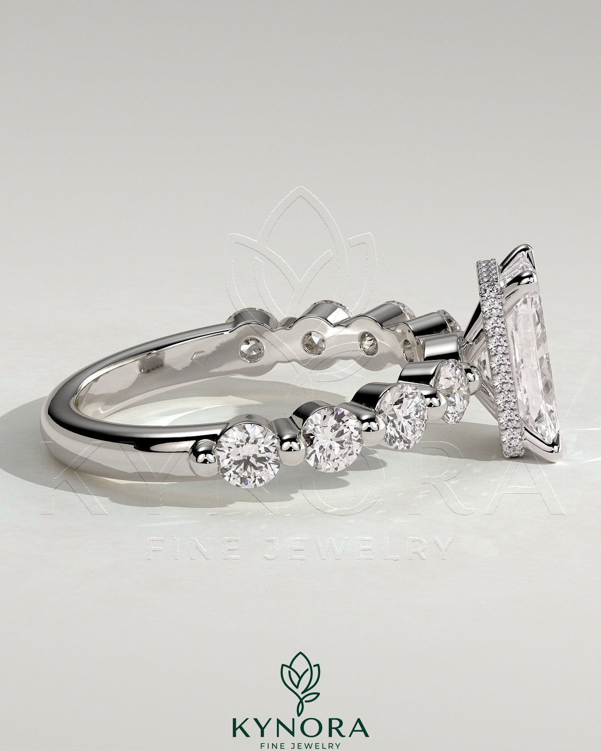 Kynora CJ 2ct radiant claw solitaire engagement ring with round accent stones and hidden halo design, crafted in fine jewelry style.