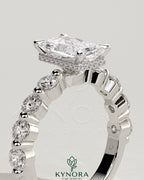 Kynora CJ 2ct radiant claw solitaire engagement ring with round accent stones and hidden halo, crafted in elegant design