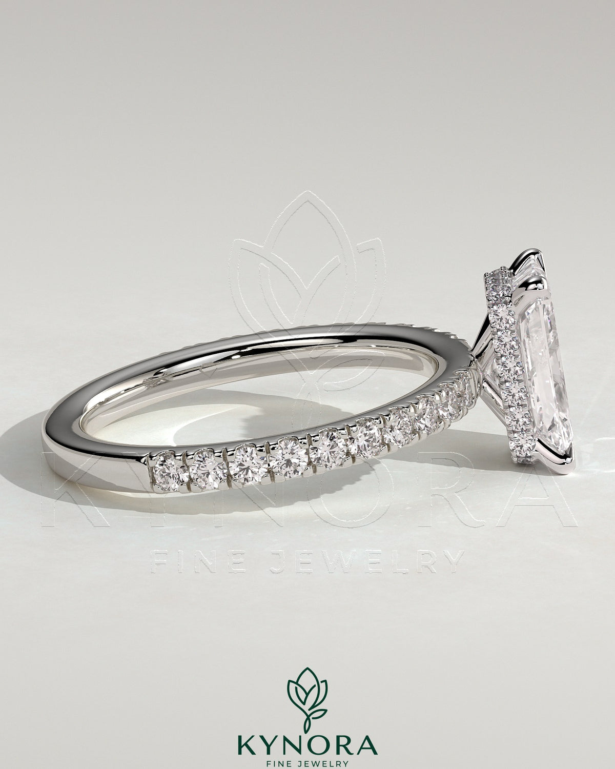 Kynora CJ 2ct radiant diamond claw solitaire engagement ring with wrap-around hidden halo and pave band, elegant and sparkling.