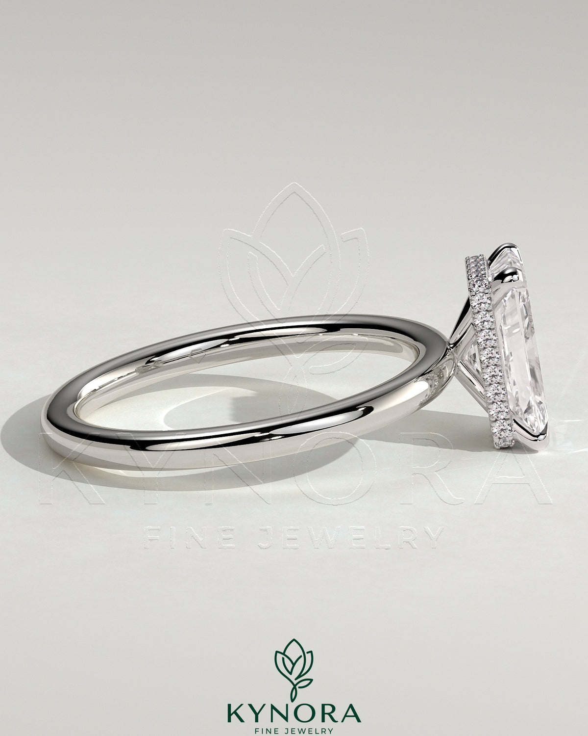 Kynora CJ 2ct radiant claw solitaire engagement ring with wrap-around hidden halo, featuring a sparkling central diamond.