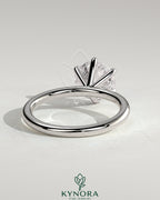 Kynora CJ 2ct round diamond claw solitaire engagement ring with a sleek band, showcasing a sparkling center stone.