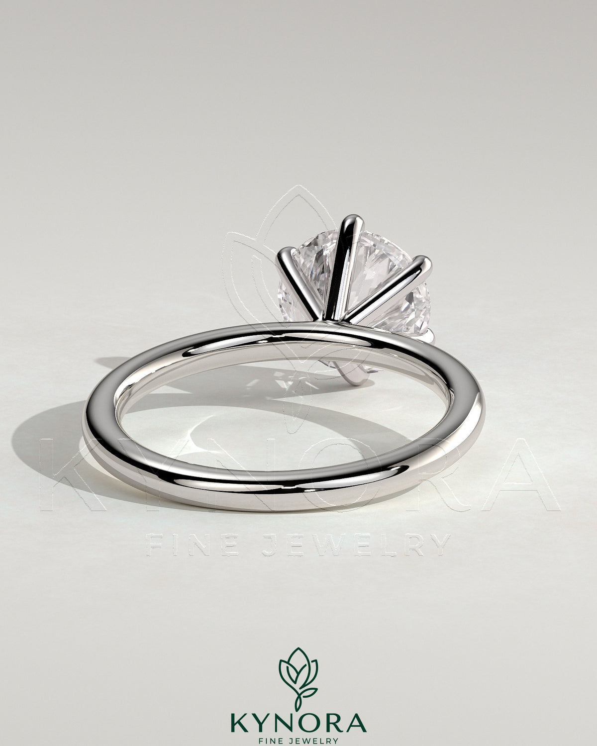 Kynora CJ 2ct round diamond claw solitaire engagement ring with a sleek band, showcasing a sparkling center stone.