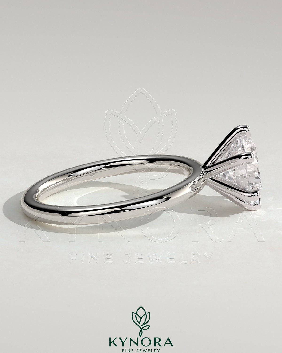 Kynora CJ 2ct round claw solitaire engagement ring featuring a sparkling central diamond on a sleek band.
