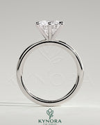 Kynora CJ 2ct round claw solitaire engagement ring featuring a single sparkling diamond set on a sleek band.