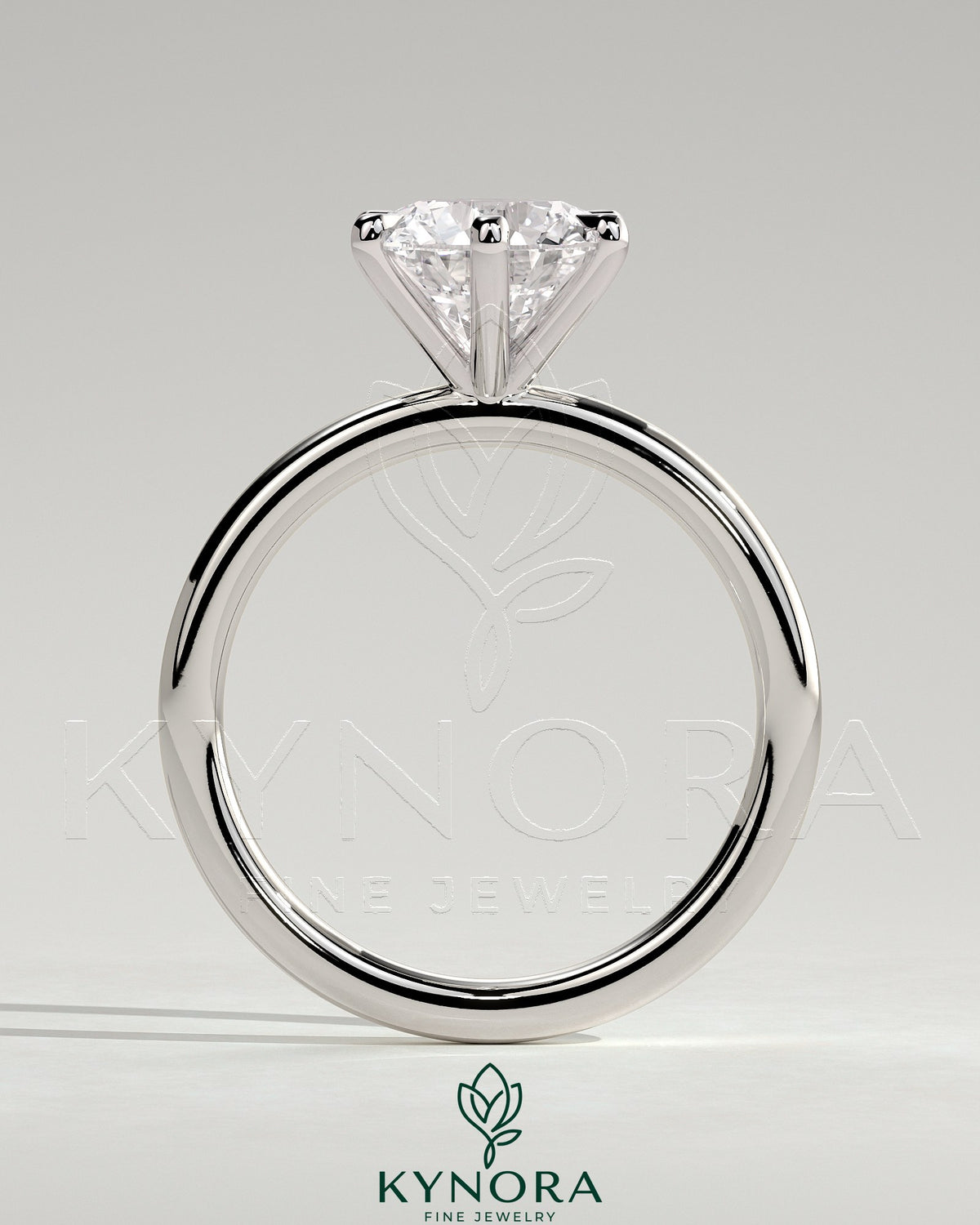 Kynora CJ 2ct round claw solitaire engagement ring featuring a single sparkling diamond set on a sleek band.