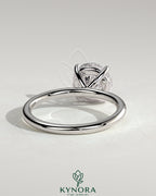 Kynora CJ 2ct round claw solitaire engagement ring in sterling silver with moissanite gemstone, stylish and elegant design.