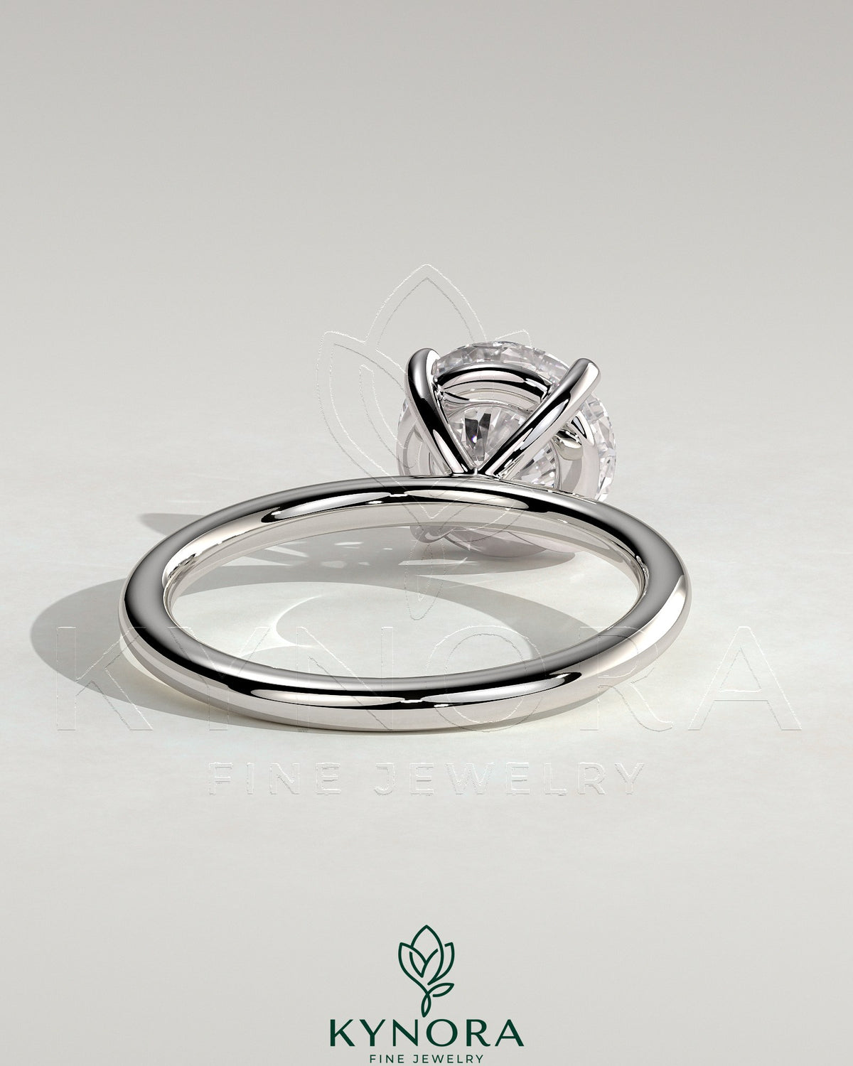 Kynora CJ 2ct round claw solitaire engagement ring in sterling silver with moissanite gemstone, stylish and elegant design.