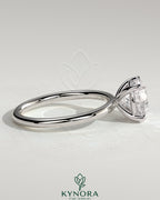 Kynora CJ 2ct round moissanite solitaire engagement ring in sterling silver with claw setting, stylish and elegant jewelry piece.