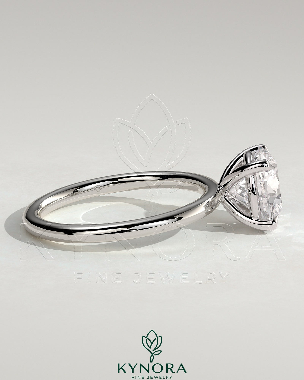 Kynora CJ 2ct round moissanite solitaire engagement ring in sterling silver with claw setting, stylish and elegant jewelry piece.