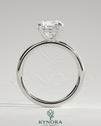 Sterling silver 2ct round moissanite solitaire engagement ring with claw setting, stylish design by Kynora CJ.