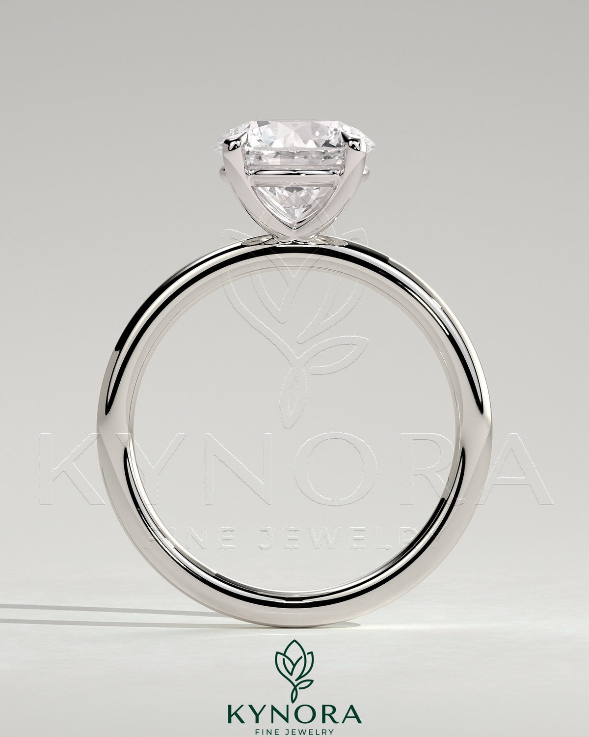 Sterling silver 2ct round moissanite solitaire engagement ring with claw setting, stylish design by Kynora CJ.