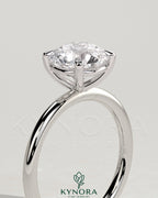 Kynora CJ 2ct round claw solitaire engagement ring with moissanite in sterling silver, stylish and elegant jewelry design