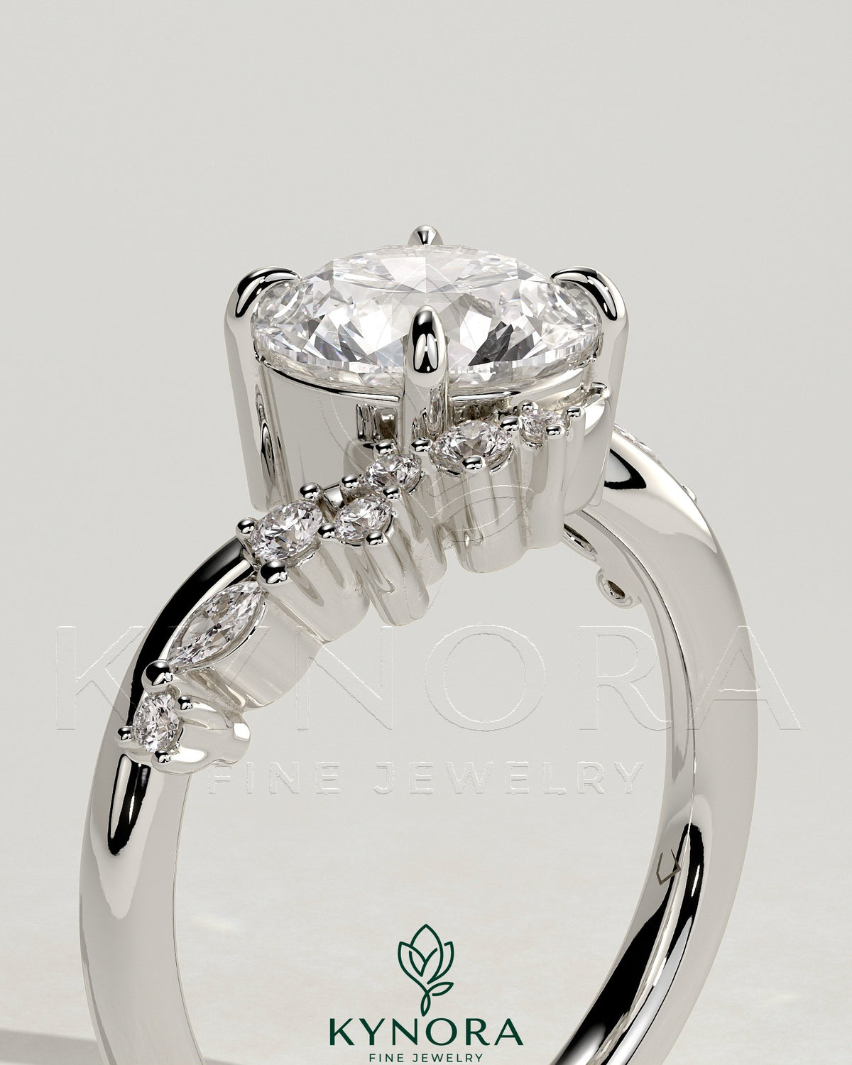 Kynora CJ 2ct round claw solitaire engagement ring with bypass band and cluster of round-marquise accent stones.