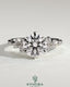 Kynora CJ 2ct round claw solitaire engagement ring with clustered round shoulder stones, showcasing a sparkling diamond design.
