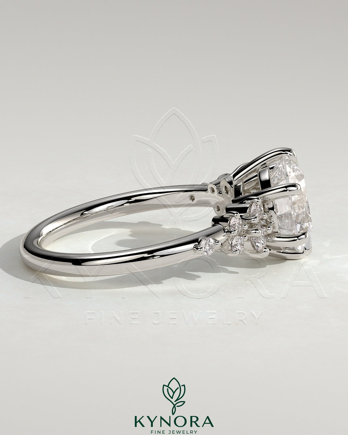 Kynora CJ 2ct round claw solitaire engagement ring with clustered round shoulder stones, elegant and sparkling jewelry piece.