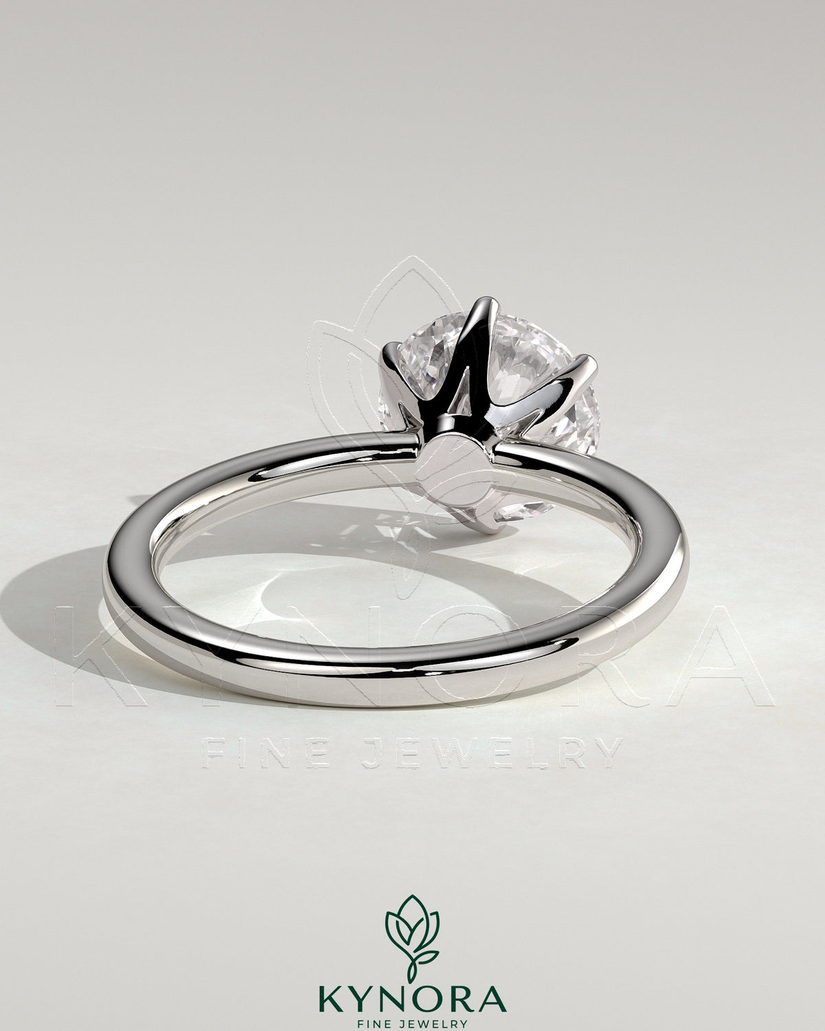 Kynora CJ 2ct round claw solitaire engagement ring with crown gallery design, featuring a sparkling center diamond.