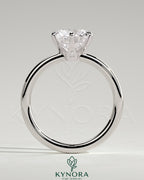 Kynora CJ 2ct round claw solitaire engagement ring with crown gallery setting, showcasing a sparkling diamond on a sleek band.