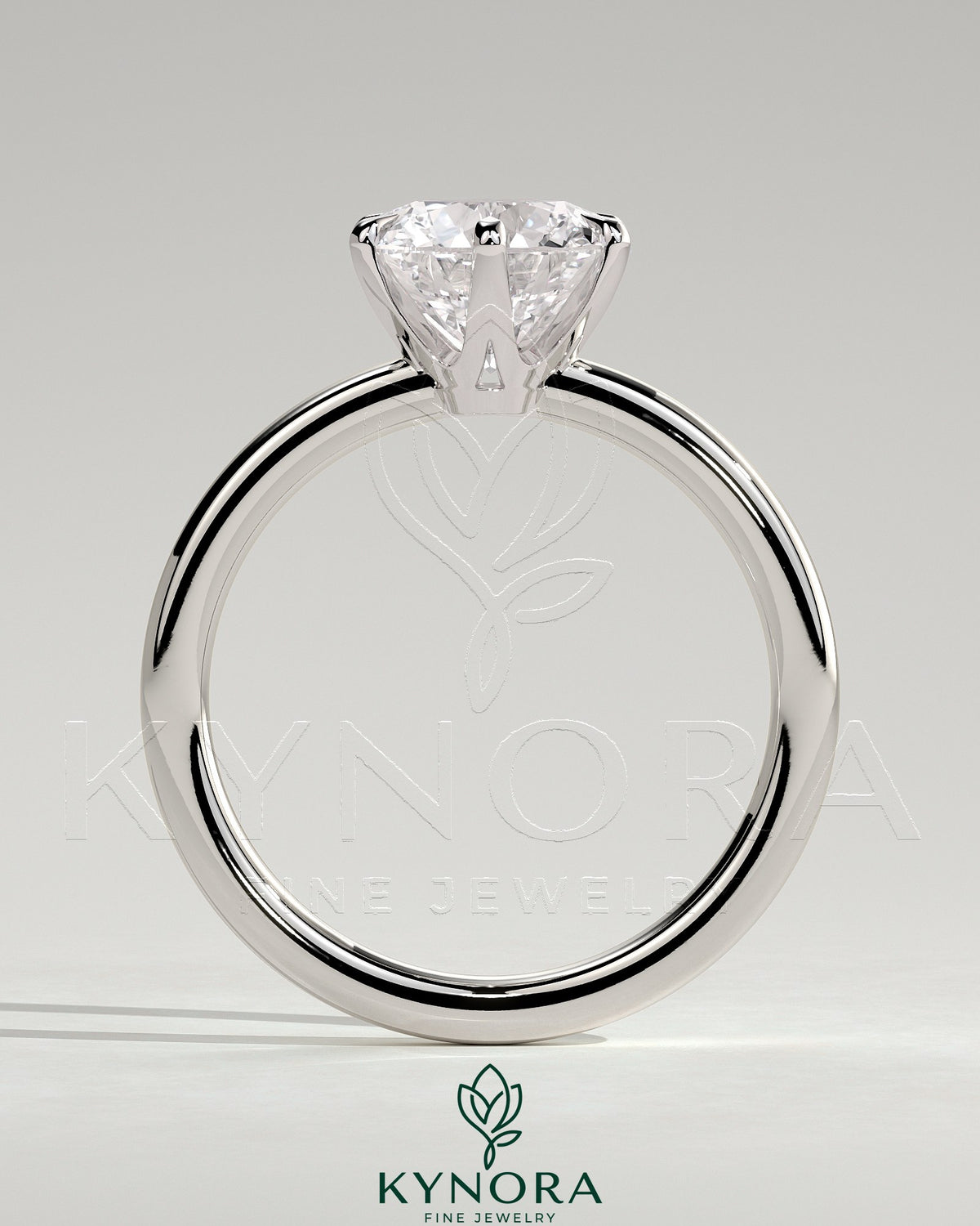 Kynora CJ 2ct round claw solitaire engagement ring with crown gallery setting, showcasing a sparkling diamond on a sleek band.