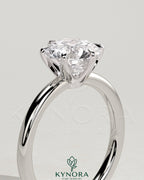 Kynora CJ 2-carat round diamond solitaire engagement ring with claw setting and crown gallery design.