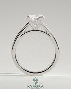 Kynora CJ 2ct round claw solitaire engagement ring with flat band and cathedral high setting, showcasing a sparkling center diamond.