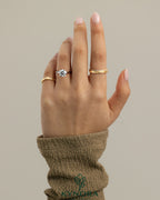 Kynora CJ 2ct round claw solitaire engagement ring with flat band and cathedral high setting, showcasing sparkling diamond and elegant design.