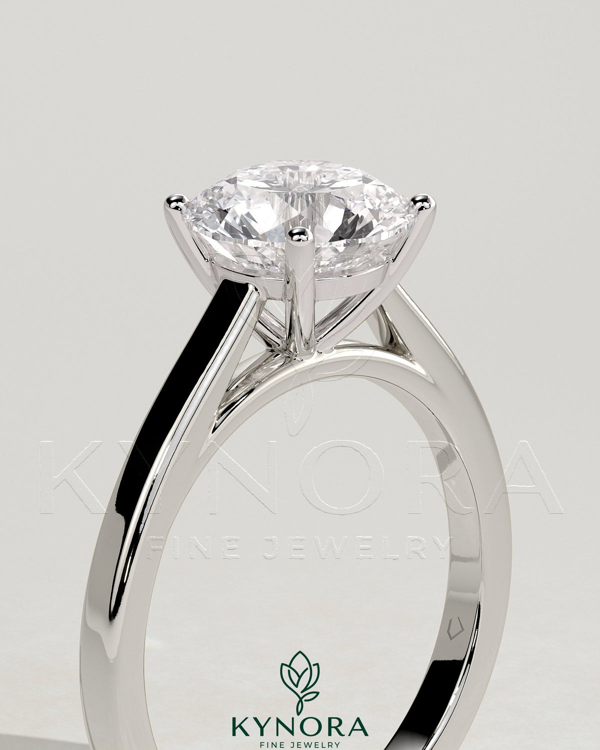 Kynora CJ 2ct round claw solitaire engagement ring with flat band and cathedral high setting, showcasing a sparkling diamond.
