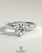 Kynora CJ 2ct round diamond claw solitaire engagement ring with flat cigar band and hidden halo design.