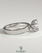 Kynora CJ 2ct round diamond solitaire engagement ring with flat cigar band and hidden halo design, showcasing sparkling diamond and elegant band.