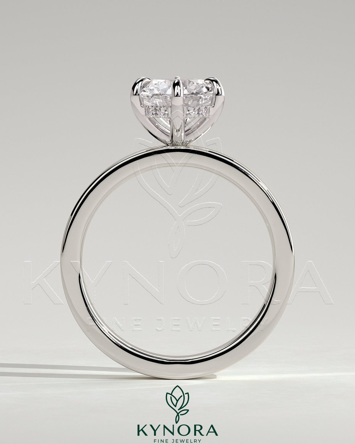 Kynora CJ 2ct round diamond claw solitaire engagement ring with flat cigar band and hidden halo design.