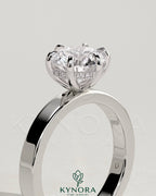 Kynora CJ 2ct round diamond claw solitaire engagement ring with flat cigar band and hidden halo design.