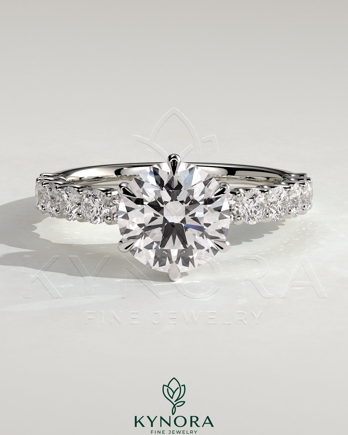 Kynora CJ 2ct round diamond claw solitaire engagement ring with half eternity band, showcasing sparkling center stone and elegant design. Main image