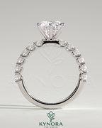 Kynora CJ 2ct round claw solitaire engagement ring with half eternity band, featuring a sparkling central diamond and elegant design.