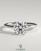 Kynora CJ 2ct round diamond solitaire engagement ring with hidden halo and floating cathedral low setting, elegant jewelry.